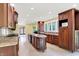 Spacious kitchen features custom cabinets, a center island, stainless appliances, and tile flooring at 8602 Frontgate Ln, Indianapolis, IN 46256