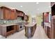 Modern kitchen with stainless steel appliances, custom cabinetry, and a spacious center island at 8602 Frontgate Ln, Indianapolis, IN 46256