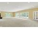 Open living room with large windows offering ample natural light and outdoor views at 8602 Frontgate Ln, Indianapolis, IN 46256