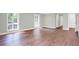 Living room featuring hardwood floors, natural light and interior doors at 8602 Frontgate Ln, Indianapolis, IN 46256