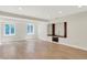 Spacious living room with hardwood floors and built-in shelving at 8602 Frontgate Ln, Indianapolis, IN 46256