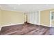 Neutral living room featuring hardwood floors, built-in shelving, and natural light at 8602 Frontgate Ln, Indianapolis, IN 46256