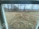Backyard view through window, highlighting the property's surroundings at 9497 Dogwood Dr, McCordsville, IN 46055