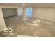 Unfinished basement with concrete floors and ample open space at 9497 Dogwood Dr, McCordsville, IN 46055