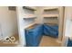 Close-up of a corner in the kitchen with cabinets, floating shelves, and new countertops at 9497 Dogwood Dr, McCordsville, IN 46055