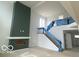 Spacious living room showcasing tall fireplace, stairs, and high ceilings at 9497 Dogwood Dr, McCordsville, IN 46055