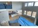A birds-eye view of this open-concept kitchen and great room with many windows for natural light at 9497 Dogwood Dr, McCordsville, IN 46055