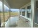 Covered porch with expansive views of the backyard at 9497 Dogwood Dr, McCordsville, IN 46055