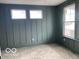 Stylish room with board and batten accent wall and natural light at 9497 Dogwood Dr, McCordsville, IN 46055