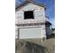 New construction home exterior showcasing a two-car garage and vinyl siding at 1078 Tomahawk Pl, Martinsville, IN 46151