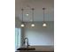 Modern pendant lighting over a kitchen island, providing ambient and task lighting at 1078 Tomahawk Pl, Martinsville, IN 46151