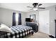 Bright bedroom featuring a ceiling fan and dresser at 10874 S 250 W, Flat Rock, IN 47234