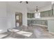 Charming kitchen with light green cabinets and marble countertops at 1103 W 5Th St, Anderson, IN 46016