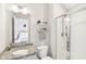 Clean bathroom with a granite countertop, a shower, and built-in shelving at 14292 Dufton Ct, Carmel, IN 46074