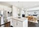 Modern kitchen with large island and stainless steel appliances at 14292 Dufton Ct, Carmel, IN 46074