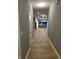 View into the modern kitchen from the hallway at 1440 Wigwam Ln, Martinsville, IN 46151