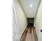 Long, narrow basement storage closet with wood flooring at 1644 Hunting Horn Cir, Indianapolis, IN 46260