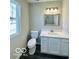 Bathroom with white vanity, quartz countertop and gray flooring at 1644 Hunting Horn Cir, Indianapolis, IN 46260