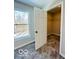 Spacious bedroom closet with wire shelving and neutral carpeting at 1644 Hunting Horn Cir, Indianapolis, IN 46260