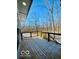 Wooden deck overlooking a snowy wooded area at 1644 Hunting Horn Cir, Indianapolis, IN 46260