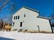 Gray house exterior with deck and snowy yard at 1644 Hunting Horn Cir, Indianapolis, IN 46260