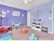 Spacious playroom with colorful decor, toys, and a play table at 1710 Elderberry Dr, Indianapolis, IN 46234