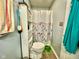 Clean bathroom with floral shower curtain and updated vanity at 1842 Queensbridge Dr, Indianapolis, IN 46219