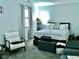Spacious bedroom with ample natural light and comfortable seating at 1842 Queensbridge Dr, Indianapolis, IN 46219