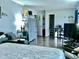 Bedroom with gray bedding and large TV at 1842 Queensbridge Dr, Indianapolis, IN 46219