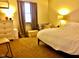 Bright bedroom with large bed, dresser, and window at 1842 Queensbridge Dr, Indianapolis, IN 46219