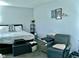 Bright bedroom featuring a king-size bed and relaxing sitting area at 1842 Queensbridge Dr, Indianapolis, IN 46219