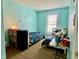 Charming bedroom with twin beds and dinosaur theme at 1842 Queensbridge Dr, Indianapolis, IN 46219