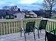 Deck with two chairs overlooking a grassy area at 1842 Queensbridge Dr, Indianapolis, IN 46219