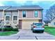 Exterior of charming condo with attached garage and landscaping at 1842 Queensbridge Dr, Indianapolis, IN 46219