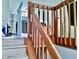 Wooden staircase with simple railing and baby gate at 1842 Queensbridge Dr, Indianapolis, IN 46219
