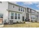 Townhome backyard with small patio, grill, and lawn at 18655 Moray St, Westfield, IN 46069