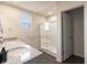Bathroom with granite countertop, double sinks and shower at 18655 Moray St, Westfield, IN 46069