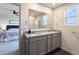 Double vanity bathroom with granite countertop and a shower at 18655 Moray St, Westfield, IN 46069