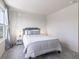 Bright bedroom with gray carpeting and a comfortable-looking bed at 18655 Moray St, Westfield, IN 46069