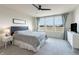 Main bedroom with ceiling fan, large windows and TV at 18655 Moray St, Westfield, IN 46069