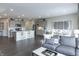 Open concept kitchen with island, stainless steel appliances, and gray cabinets at 18655 Moray St, Westfield, IN 46069