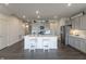 Modern kitchen with island, stainless steel appliances, and gray cabinets at 18655 Moray St, Westfield, IN 46069