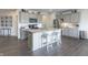 Modern kitchen with gray cabinets, stainless steel appliances and kitchen island at 18655 Moray St, Westfield, IN 46069