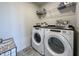 Laundry room with Whirlpool washer and dryer, and a shelving unit at 18655 Moray St, Westfield, IN 46069