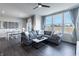 Open living space featuring a gray sectional sofa and ample natural light at 18655 Moray St, Westfield, IN 46069