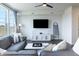 Cozy living room with sectional sofa, coffee table, and large windows at 18655 Moray St, Westfield, IN 46069