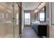 Bathroom with double vanity, large mirror, and walk-in shower at 2009 Carrollton Ave, Indianapolis, IN 46202