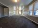 Spacious living room featuring hardwood floors and large windows at 2104 Drexel Dr, Anderson, IN 46011