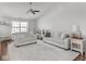 Bright living room featuring hardwood floors, neutral-toned furniture, and a cozy atmosphere at 2240 Mozart Dr, Greenfield, IN 46140