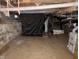 Unfinished basement with dirt floor and exposed utilities at 2317 Fowler St, Anderson, IN 46012